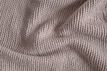 Fototapeta na wymiar Beige knitting wool texture background