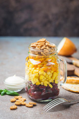 Simple Homemade Mason Jar Salad with corn, onion, beans, carrots, croutons and mayonnaise