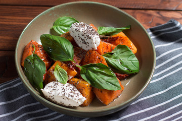 salad with pumpkin, feta cheese, cottage cheese, Chia seeds and Basil