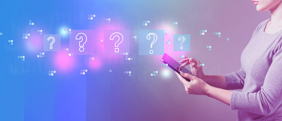 Question marks with business woman using a tablet computer 