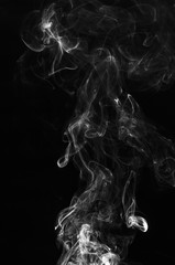 abstract swirl fragment shape movement motion effect of white smoke on black background. burn of...