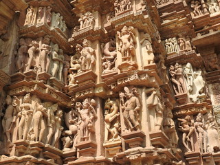 The Western group of Khajuraho temples, a UNESCO heritage site, is famous for its erotic sculptures, India, clear day.