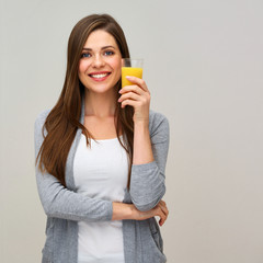 smiling woman holding orange juice drink.