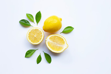 Lemon and slices with leaves isolated on white.