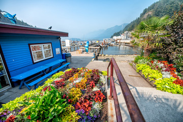 Ferry public dock with flowers and wooden house