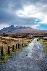 Old massive stone bridge crossing shallow river in Sligachan, Isle of Skye, Scotland