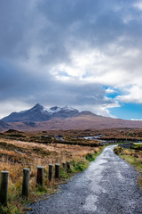 Old massive stone bridge crossing shallow river in Sligachan, Isle of Skye, Scotland