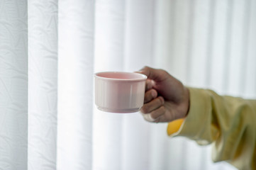Hand image and coffee mug Coffee drinking concept