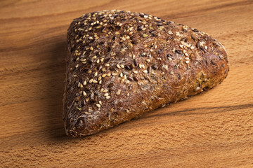 Integral bread in the form of a triangle with linseed, oats and sesame seeds