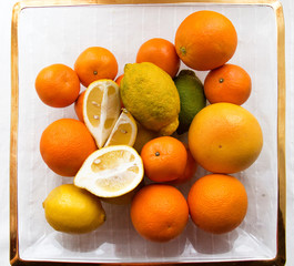 citrus fruits are stacked in a basket