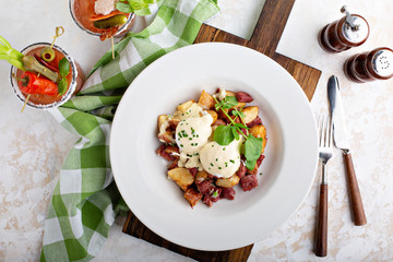 Breakfast potatoes with eggs Benedict and corned beef