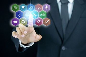 Businessman pointing his finger on digital icon
