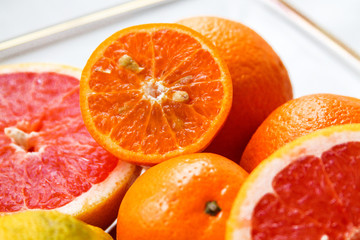 many sliced citrus fruits are on the table