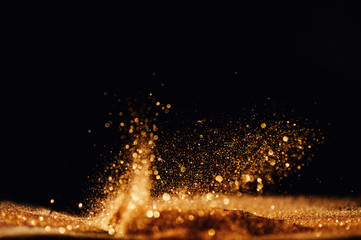 Fototapeta na wymiar glitter vintage lights background. gold and black. de focused