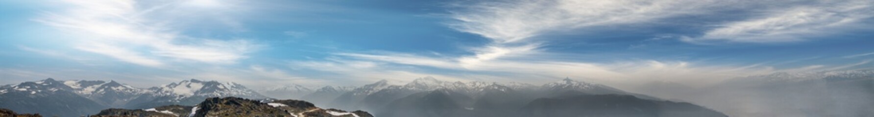 Panoramic sunset aerial view of Whistler mountains in summer