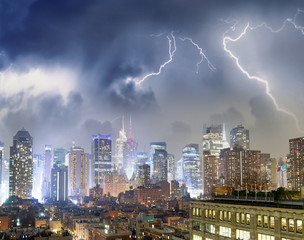 Aerial view of Midtown Manhattan skyline with storm in the background