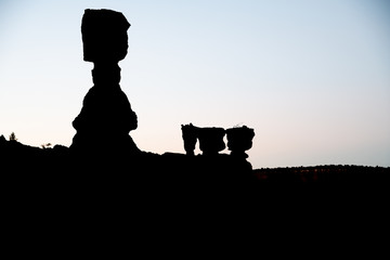 Bryce Canyon National Park hoodoos silhouettes at sunrise with Thor's Hammer, Utah, USA