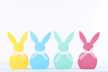 Easter paper rabbits on white background