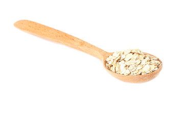 Oatmeal in wooden spoon isolated on white background