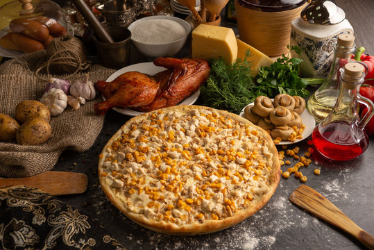 Pizza with chicken, mushrooms and sweet corn