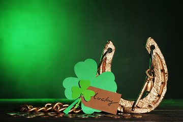 St.Patrick's Day. Golden horseshoe with clover leafs and coins