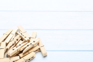 Brown clothespins on wooden table