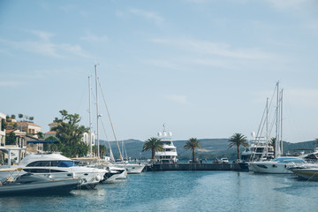 Obraz premium yachts in montenegro bay. mountains on background