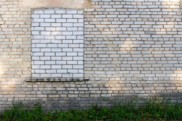 Old wall with bricked up windows