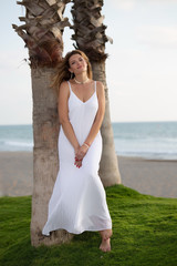 Fototapeta na wymiar Woman in white by the sea