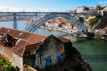 aerial view of porto portugal with dom luis bridge, douro river rabelos boats