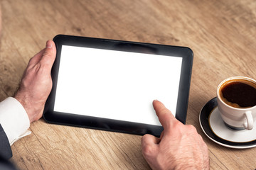 Close up businessman pointing to digital tablet in meeting