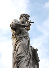 Statue of Saint Peter with long beard and the keys in in the gre