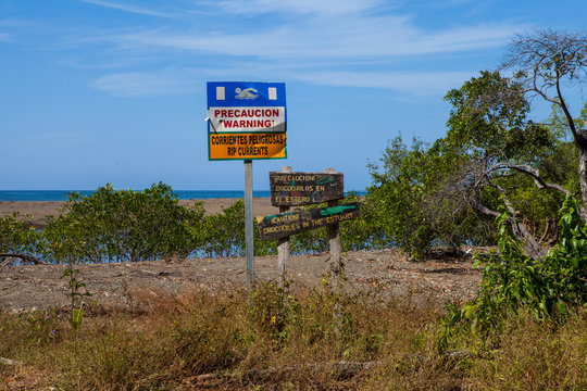 Playa Barrigona, Samara/ Costa Rica -January 28, 2019: Crocodile warning sign and rip currents warning sign in a Playa Barrigona, Costa Rica. - Image