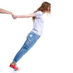 Woman pulls the hand of a man on a white background isolation