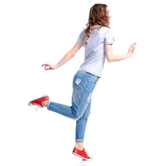 Woman in jeans smiling walking dream on white background isolation