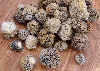 Mushrooms morels on a wooden board.