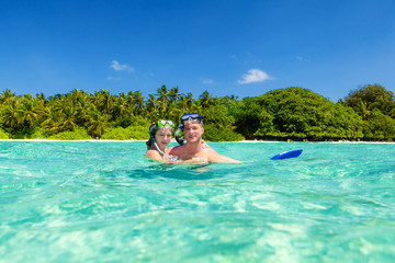 Young Couple enjoying in the turquoise water