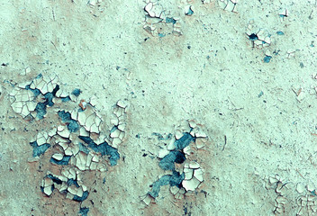 Old wooden background with remains of pieces of scraps of old paint on wood. Texture of an old tree, board with paint, vintage background peeling paint. 