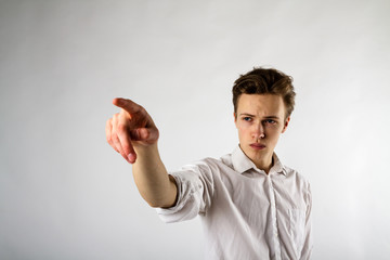 Young man is pushing the virtual button.