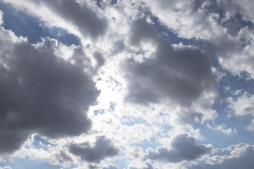 Dark air clouds in the blue sky.