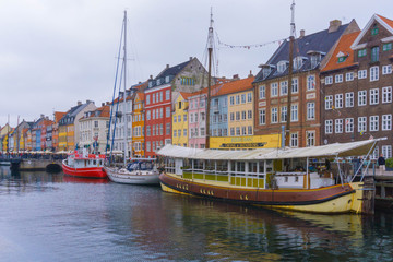 The colorful row of buildings along the waterfront at the Nyhavn district in Copenhagen