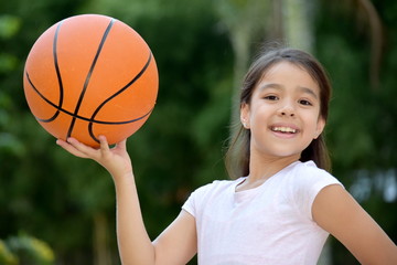 Happy Female Athlete Child Basketball Player With Basketball