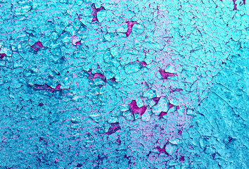Old wooden background with remains of pieces of scraps of old paint on wood. Texture of an old...
