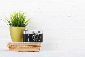 Loft home office workplace with plant and camera