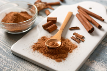 cinnamon powder on white cutting board