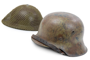 Fototapeta premium German and British World War Two military helmets, battle of Normandy 1944