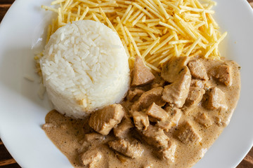 Chicken stroganoff meal on wood