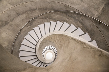Empty interior spiral modern concrete stairs