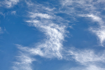 Bright winter sky with few cirrus clouds