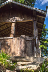 Fototapeta na wymiar wooden cabin on the mountain of Bulgaria front of the door